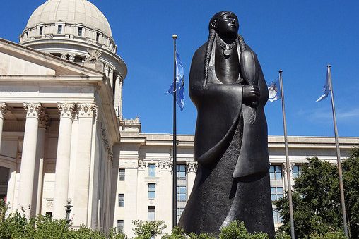 Oklahoma State Capitol with statue of Native American woman